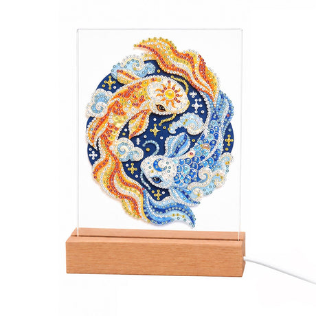 Gold and Blue Koi Yin-Yang light-up pearl painting – Orange koi and blue koi circling in a round sun-and-moon design of waves and stars