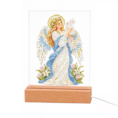 Haloed Angel with a White Dove light-up pearl painting – Angel with a golden halo, white wings and a blue and white gown holding a white dove among flowers