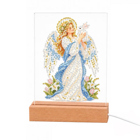 Haloed Angel with a White Dove light-up pearl painting – Angel with a golden halo, white wings and a blue and white gown holding a white dove among flowers