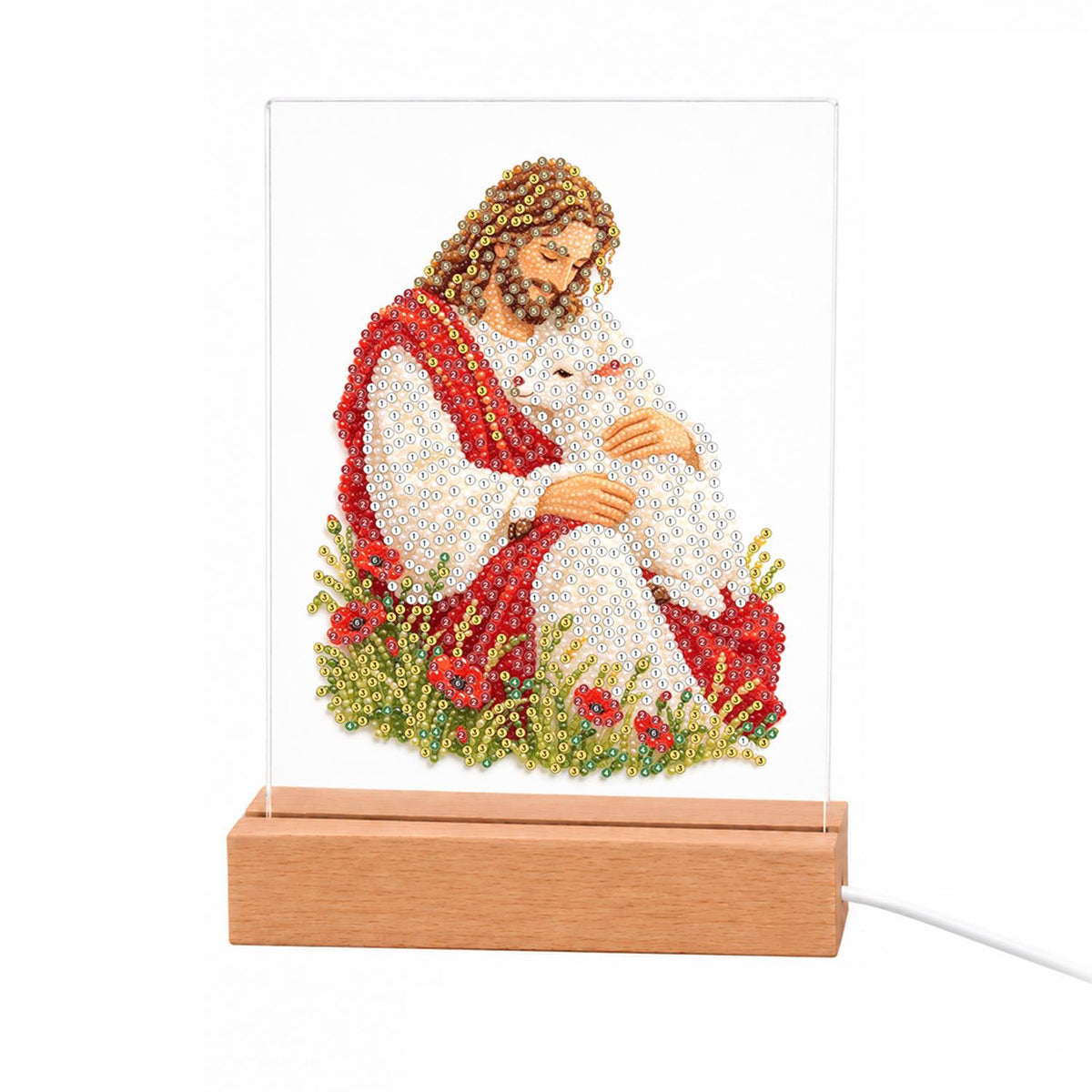The Good Shepherd with a Lamb light-up pearl painting – Jesus in red and white robes cradling a white lamb among red poppies and green grass