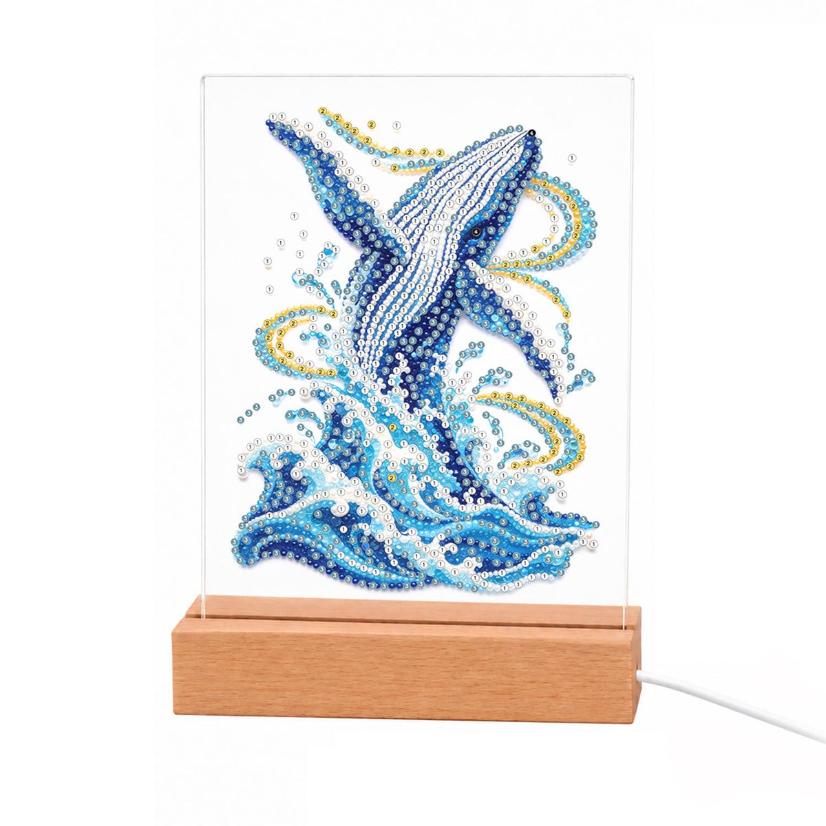 Humpback Breaching in Gold Swirls light-up pearl painting – Blue humpback whale leaping upward from foaming waves with golden swirls of spray