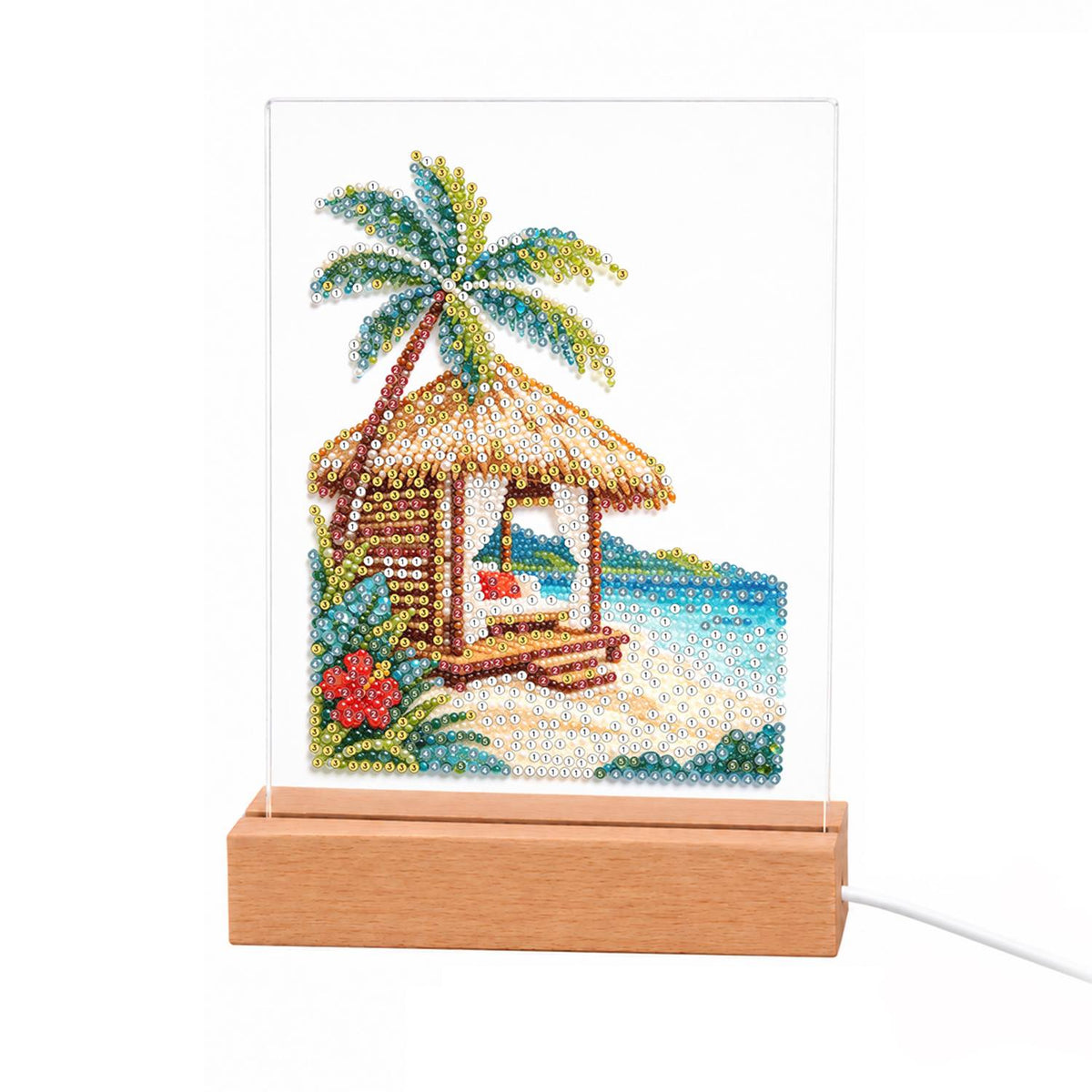 Thatched Cabana with Hibiscus light-up pearl painting – Thatched beach cabana under a palm tree with red hibiscus, white sand and turquoise sea
