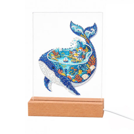 Whale with a Harbor Town Inside light-up pearl painting – Blue whale whose body holds a little island town, a sailboat, waves and coral