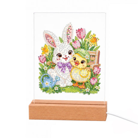 Bunny and Chick in Spring Tulips light-up pearl painting – White bunny with a purple bow and a yellow chick in a green hat among tulips, with a watering can