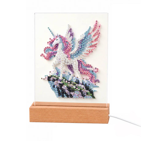 Pastel Pegasus on a Crystal Cliff light-up pearl painting – White winged horse with a pink and blue mane and wings, rearing on a dark blue crystal rock