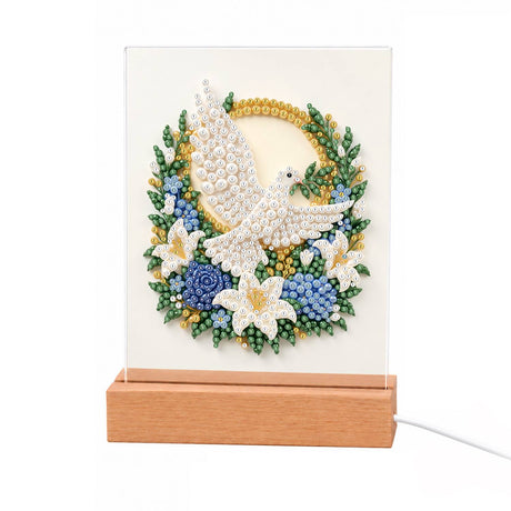 Dove in a Blue Rose Wreath light-up pearl painting – White dove in flight inside a round wreath of blue roses, white lilies and green leaves