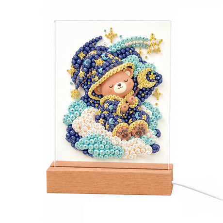 Teddy Bear in a Starry Nightcap light-up pearl painting – Brown teddy bear in a navy starry nightcap and robe asleep on clouds under a shooting star
