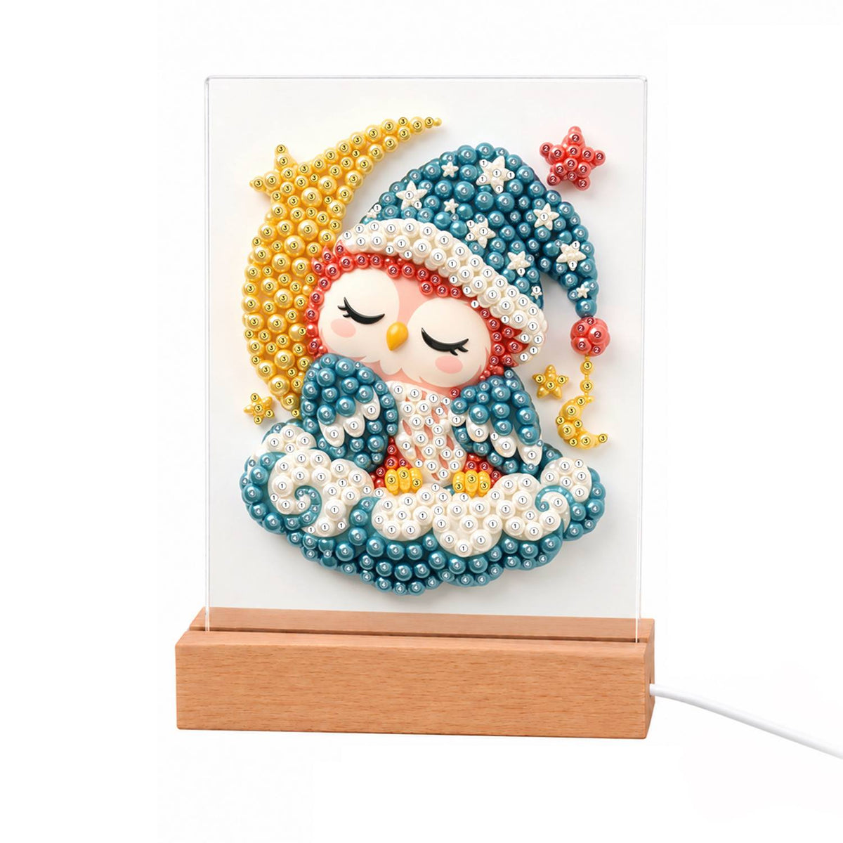 Sleepy Owl by the Crescent Moon light-up pearl painting – Sleeping owl in a blue starry nightcap and blanket on teal clouds beside a golden crescent moon