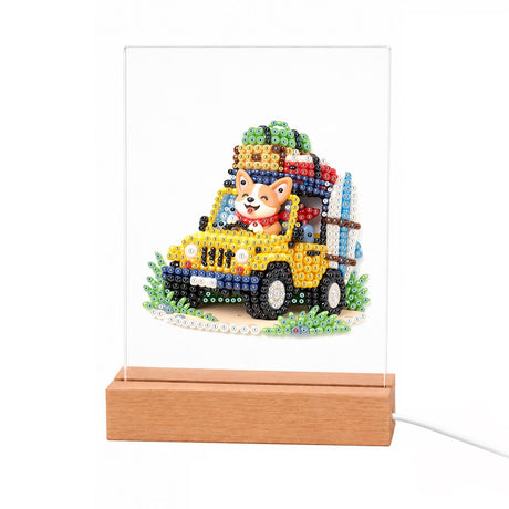Yellow Off-Roader Adventure Pup light-up pearl painting – Orange-and-white puppy driving an open yellow off-road truck loaded with luggage on the roof