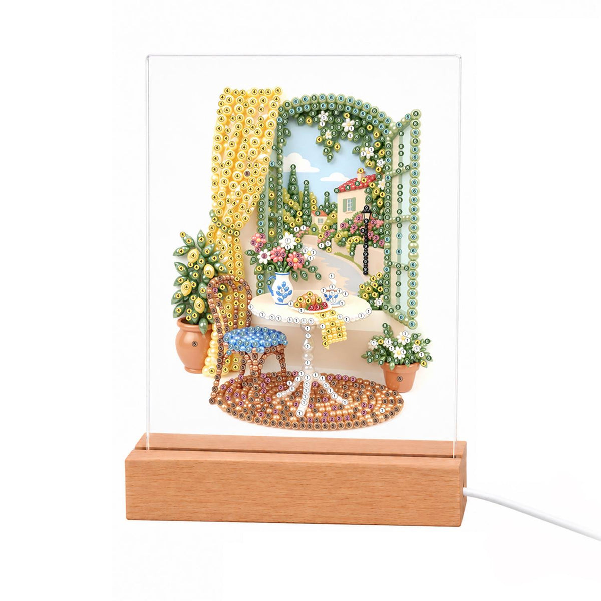 Lemon Tree by a Sunny Window light-up pearl painting – Round tea table with a blue chair and lemon tree by an open window with yellow curtains and a villa view