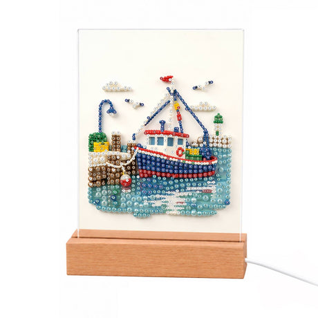Red Trawler in a Seaside Harbor light-up pearl painting – Red, white and blue fishing boat moored at a stone harbor with a lamppost and seagulls