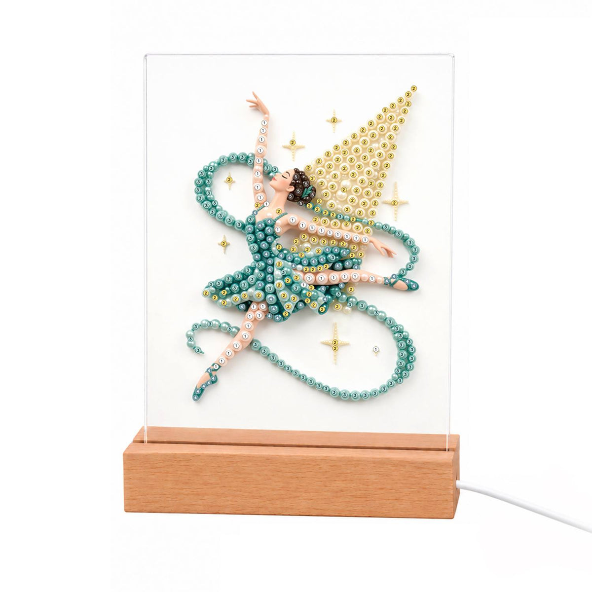 Ballerina in a Teal Ribbon Swirl light-up pearl painting – Ballerina in a teal dress leaping amid swirling teal ribbons, a gold triangle and sparkles
