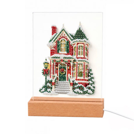 Red Victorian House in Snow light-up pearl painting – Red Victorian house with green turrets, a wreath on the door, a lamppost and snowy steps