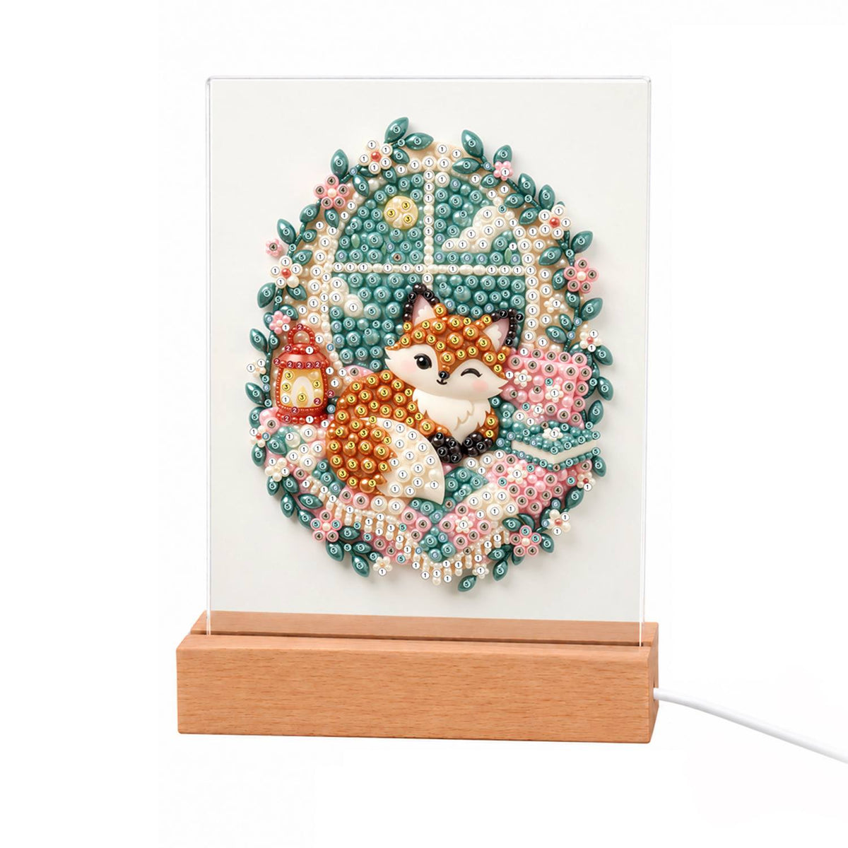 Cozy Fox by a Lantern Window light-up pearl painting – Fox curled up by a frosty window with a red lantern, framed by an oval wreath of pink flowers and leaves