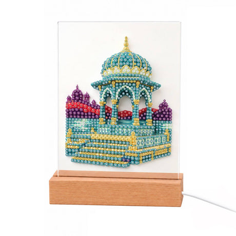 Turquoise Pavilion with Gold Spire light-up pearl painting – Turquoise domed pavilion with gold trim, a spire and wide steps, purple domes behind
