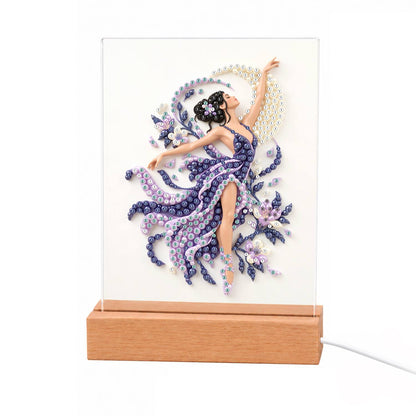 Lilac Dancer in Swirling Silk light-up pearl painting – Dancer in a flowing purple gown with one arm raised, surrounded by lilac swirls