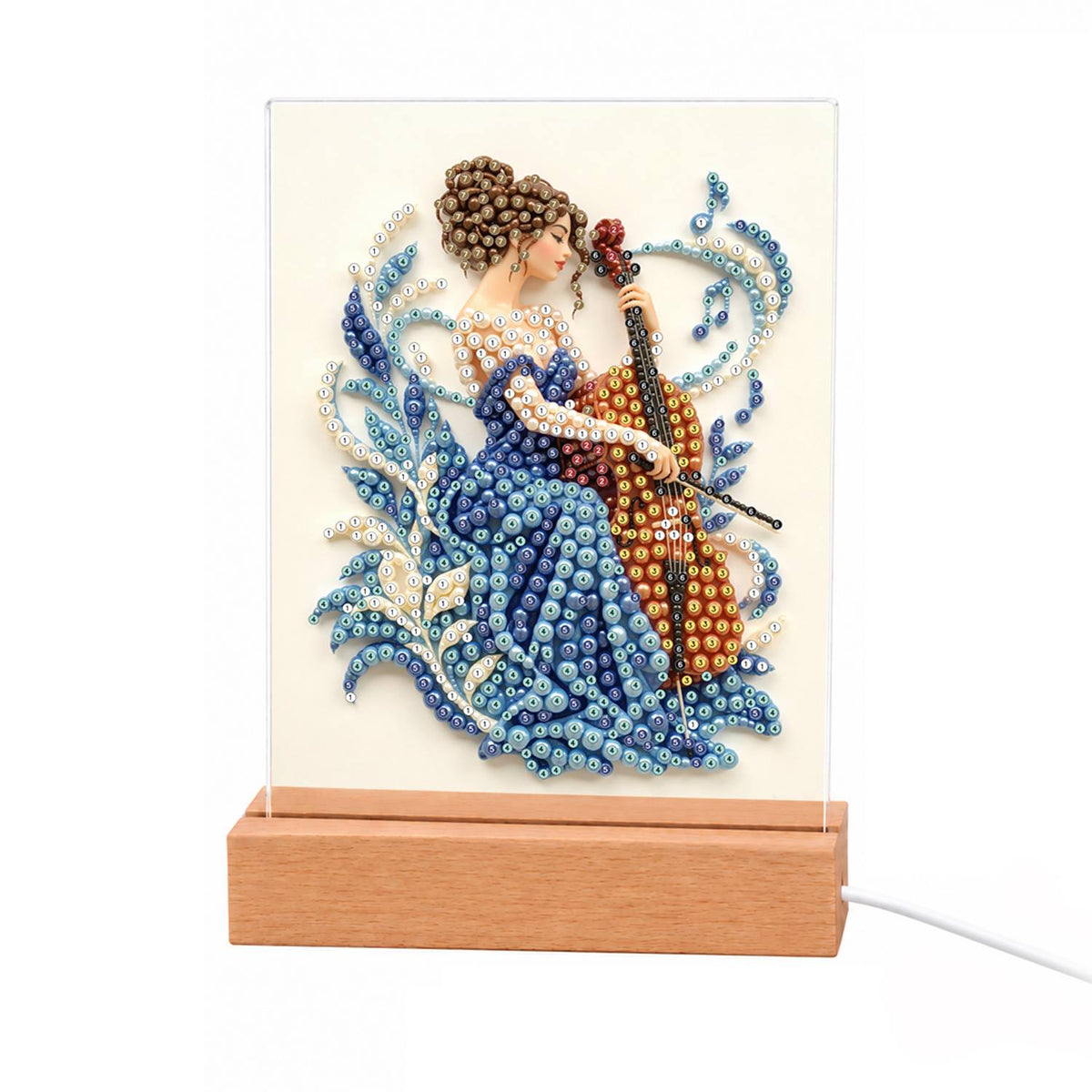 Cellist in a Sapphire Gown light-up pearl painting – Woman in a blue gown playing a cello, surrounded by blue and white swirling leaves