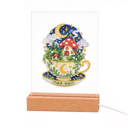 Toadstool House in a Starry Teacup light-up pearl painting – Red-capped mushroom house growing in a gold-rimmed teacup under a starry night sky with a crescent moon
