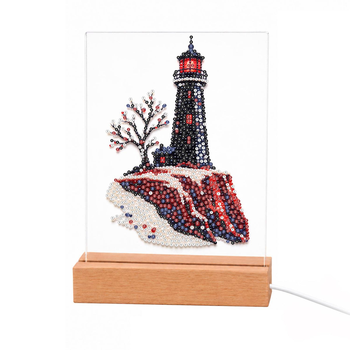 Black Lighthouse on Red Cliffs light-up pearl painting – Black lighthouse with a red lantern room on dark red cliffs beside a bare tree with pink blossoms