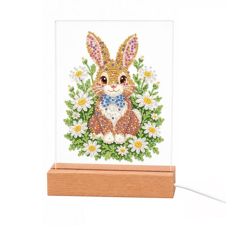 Bunny with a Blue Bow Tie light-up pearl painting – Brown bunny with tall ears and a blue bow tie sitting among white daisies