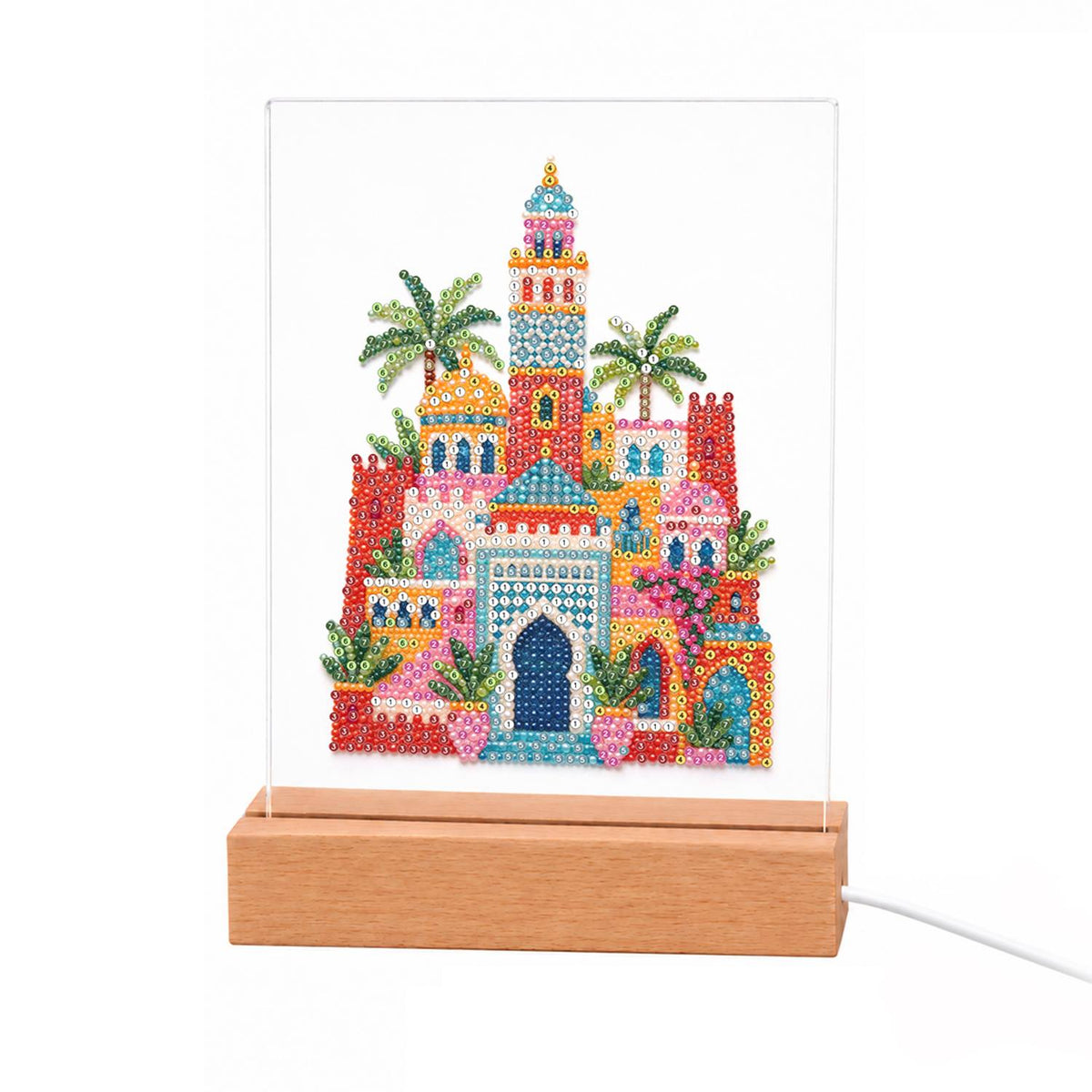 Moroccan Palace Under Palms light-up pearl painting – Colorful Moorish palace with a tall tower, keyhole arched doorway and palm trees in pink, red and teal