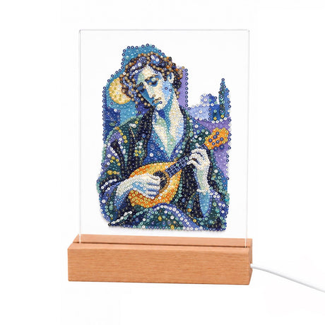 Mandolin Player in Moonlit Blue light-up pearl painting – Man in a dark blue robe playing a mandolin against a starry blue night with a crescent moon