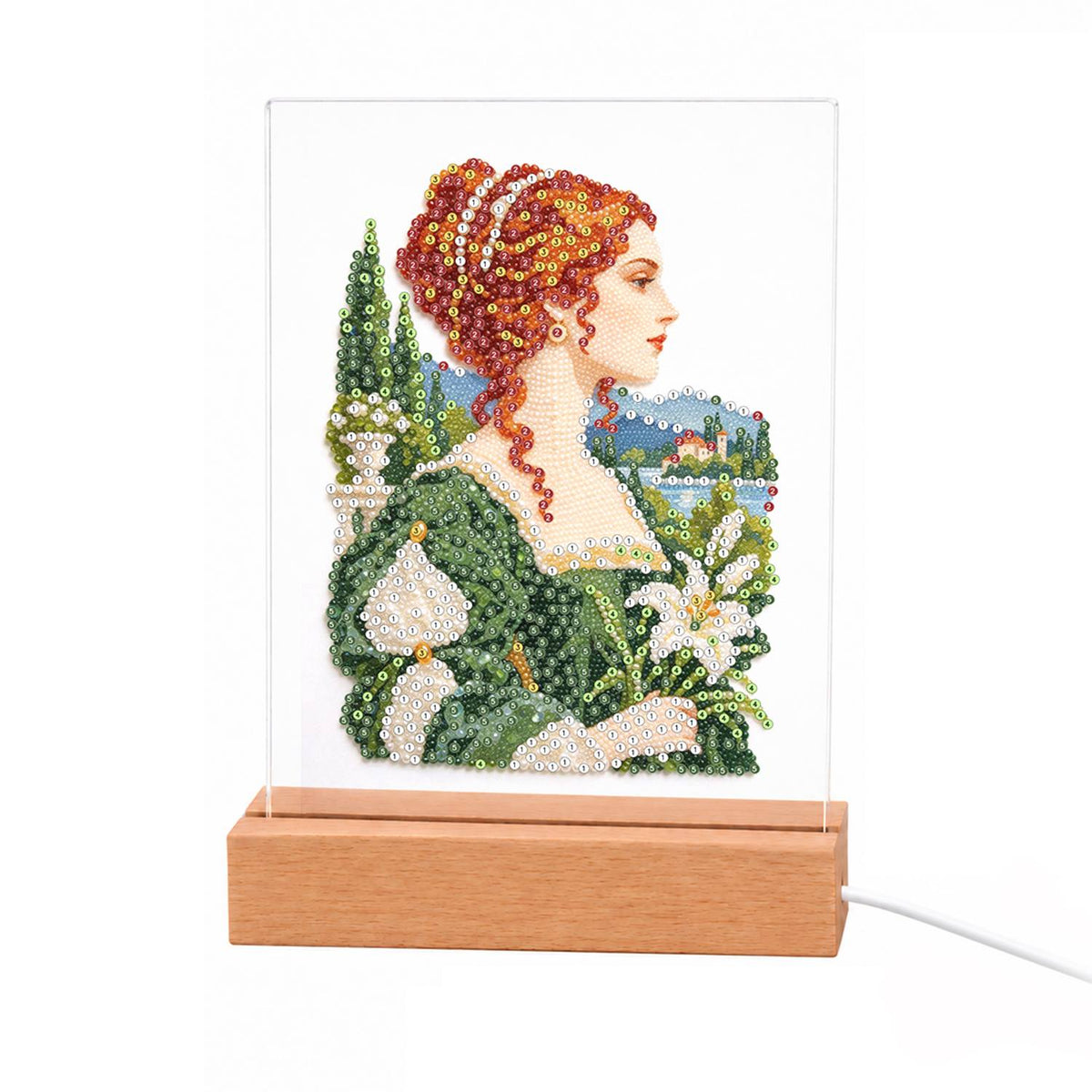Red-Haired Lady with Calla Lilies light-up pearl painting – Red-haired woman with jewels in her updo, in a green gown holding white calla lilies before a lakeside garden