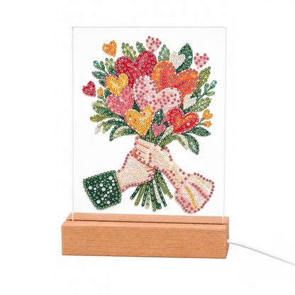 Hands Offering a Heart Bouquet light-up pearl painting – Two hands holding a bouquet of heart-shaped blooms and tulips in pink, red, coral and gold