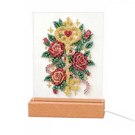 Golden Key Among Red Roses light-up pearl painting – Ornate golden key with a heart-shaped bow entwined with red roses, green leaves and a pink ribbon