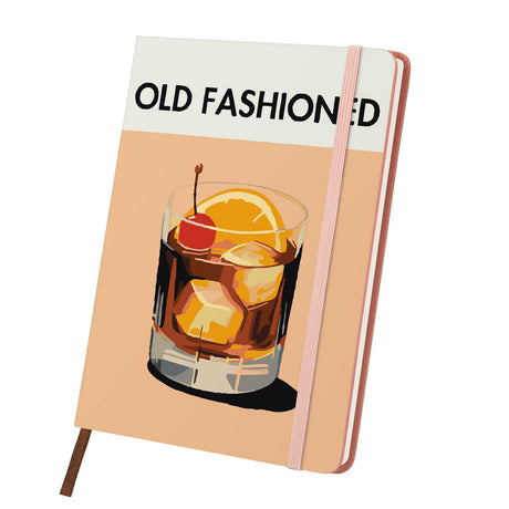 Whiskey on the Rocks with Cherry paint by numbers notebook – Amber whiskey cocktail over ice with an orange slice and cherry in a tumbler on peach, pink notebook