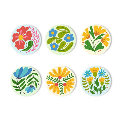 Folk Art Meadow Flowers paint by numbers coasters – Folk-style flowers in red, yellow and blue with swirling green leaves on pale blue, mint and cream