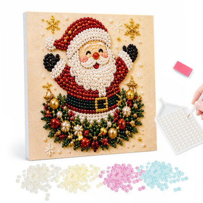 Cheering Santa in a Bauble Wreath pearl painting – Cartoon Santa with both arms raised above a wreath of red and gold baubles, on cream with gold stars