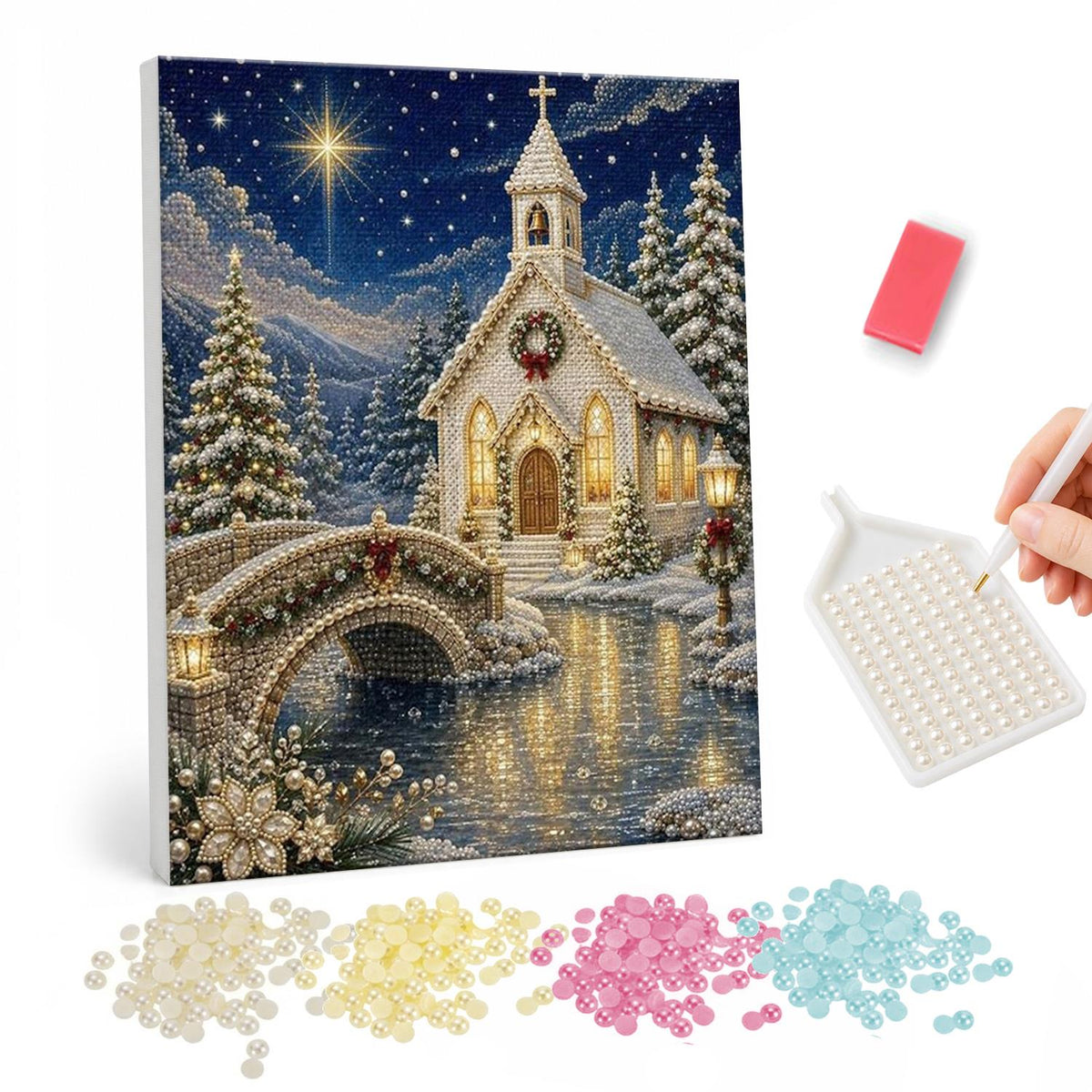 Little White Chapel at Christmas pearl painting – White chapel with a wreath and lit windows beside an arched stone bridge over a river on a starry snowy night