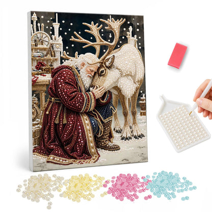 Santa Nuzzling His Reindeer pearl painting – Santa kneeling with his forehead pressed to a white reindeer's head in a snowy workshop