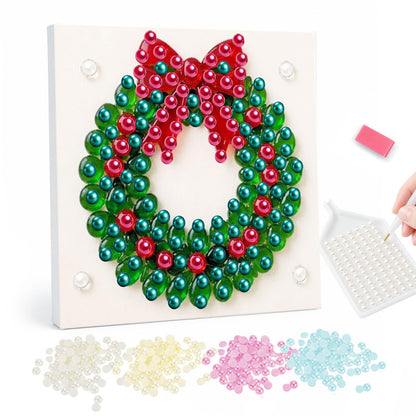 Berry Wreath with Red Bow pearl painting – Green beaded Christmas wreath with red berries and a large red bow on a white background