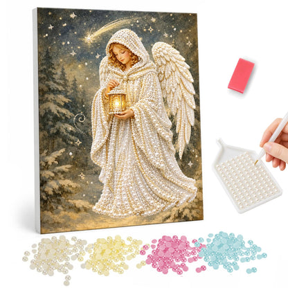 Lantern Angel in Snowy Woods pearl painting – Hooded angel in a white cloak holding a glowing lantern in a snowy pine forest under a shooting star