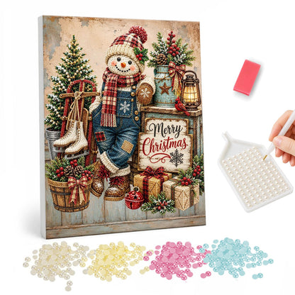 Overalls Snowman and Ice Skates pearl painting – Snowman in denim overalls and plaid scarf beside ice skates, lanterns and a Merry Christmas sign