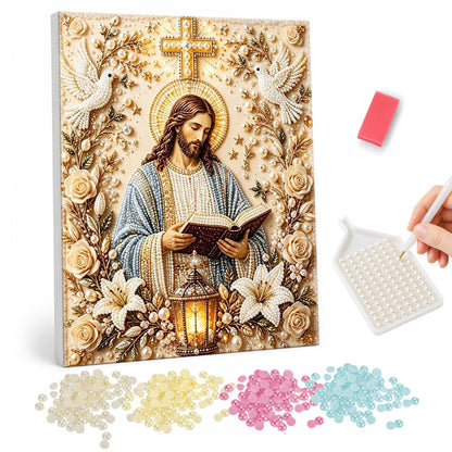 Jesus with Lantern and Lilies pearl painting – Jesus reading an open book beneath a golden cross and doves, framed by cream roses, lilies and a lantern