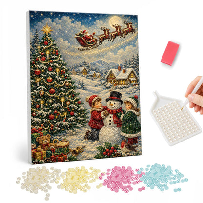 Children Building a Snowman pearl painting – Two children building a snowman by a Christmas tree as Santa's sleigh crosses the moon above a village