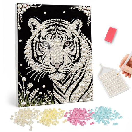 White Tiger in Meadow Grass pearl painting – White tiger with blue-gray eyes and dark stripes on black, with beaded flourishes and grass below