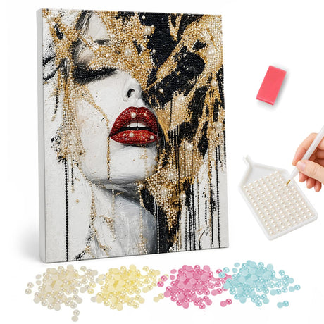 Red Lips and Golden Drips pearl painting – Woman's face with bold red lips and closed eyes, half covered in dripping gold and black paint