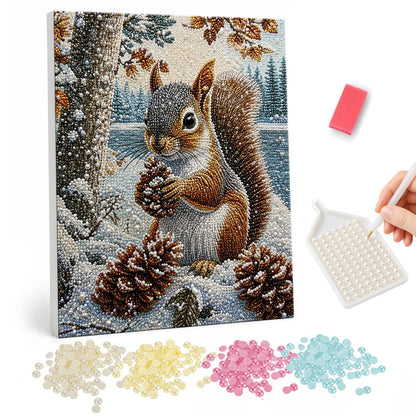 Squirrel with Pinecone in Snow pearl painting – Red squirrel holding a pinecone in a snowy forest with more pinecones at its feet