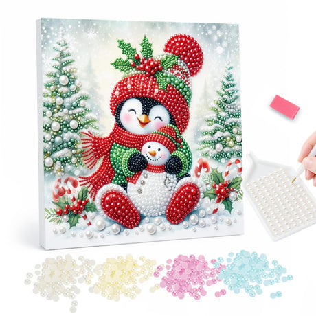 Penguin Hugging a Little Snowman pearl painting – Penguin in a red pompom hat and scarf hugging a small snowman among snowy trees and candy canes