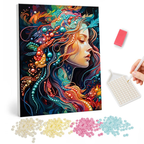 Dreamer with Swirling Jewel Hair pearl painting – Woman in profile with closed eyes and swirling teal, red and orange beaded hair on a dark background