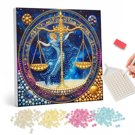 Libra Maiden with Golden Scales pearl painting – Woman in a blue gown holding golden balance scales inside a zodiac circle against a starry sky