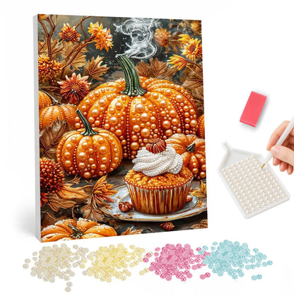 Pumpkin Spice Cupcake Harvest pearl painting – Cream-topped pumpkin cupcake on a plate before a pile of orange pumpkins, autumn leaves and wisps of steam