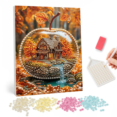 Cottage in a Glass Apple pearl painting – Tiny autumn cottage with a waterfall inside a clear glass apple, surrounded by golden leaves