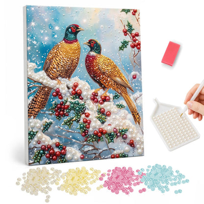 Pheasant Pair on a Snowy Bough pearl painting – Two ring-necked pheasants perched on a snowy branch with red berries and holly