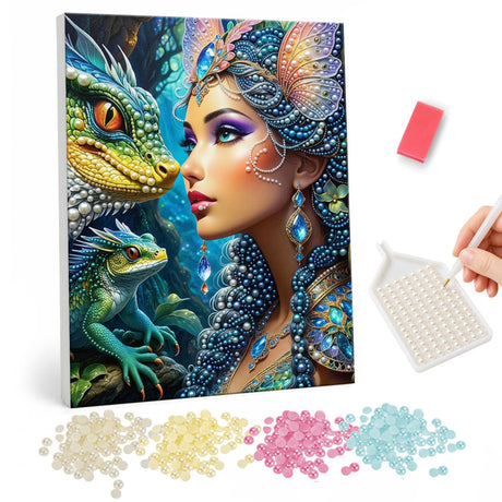 Butterfly-Crowned Dragon Whisperer pearl painting – Woman in a jeweled butterfly headdress face to face with a green dragon, a baby dragon below