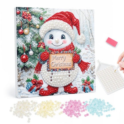 Snowman with a Merry Sign pearl painting – Snowman in a red Santa hat, scarf and boots holding a Merry Christmas sign among holly and gifts